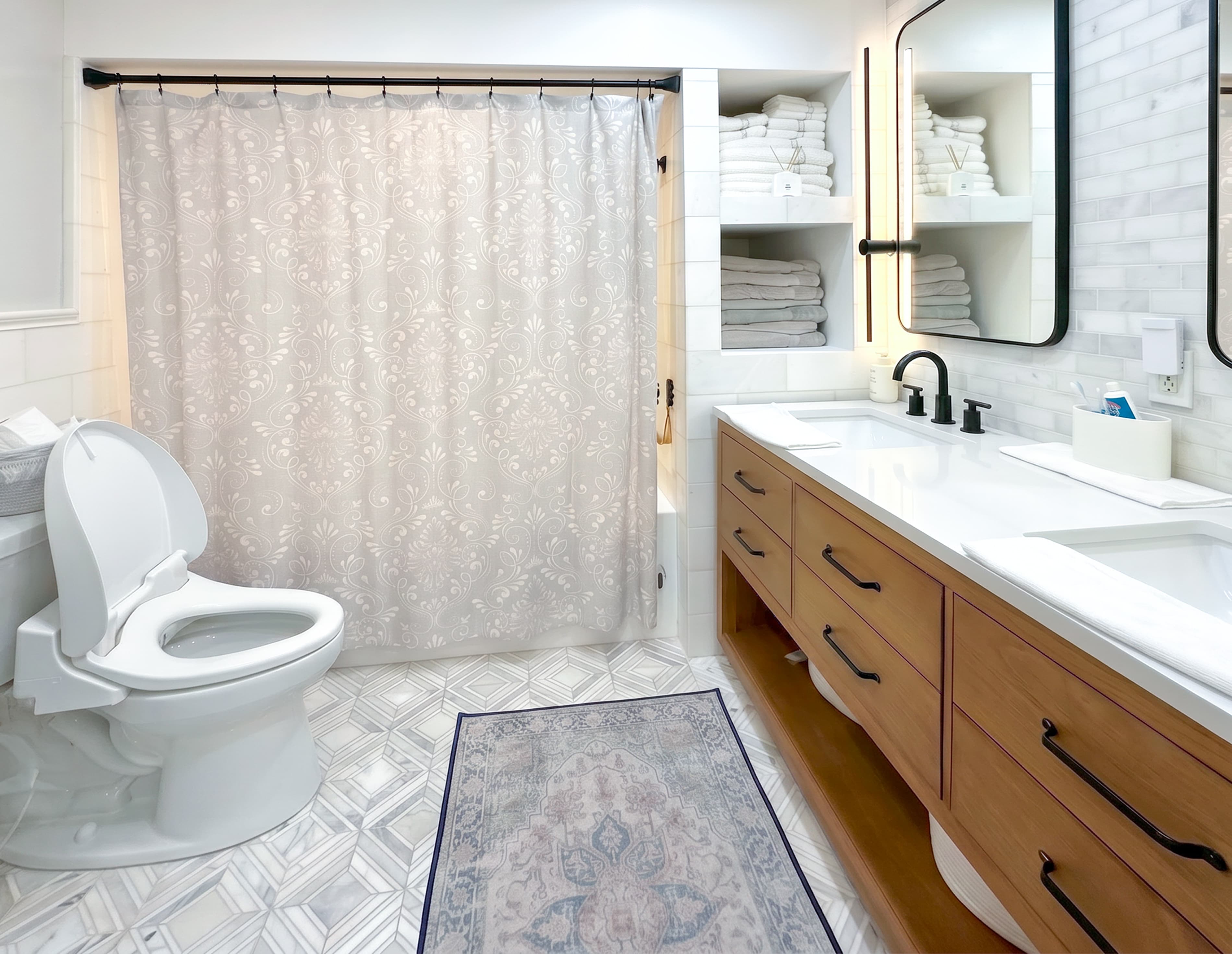 A Brookwood House bathroom with an accessible walk-in shower and grab bars.