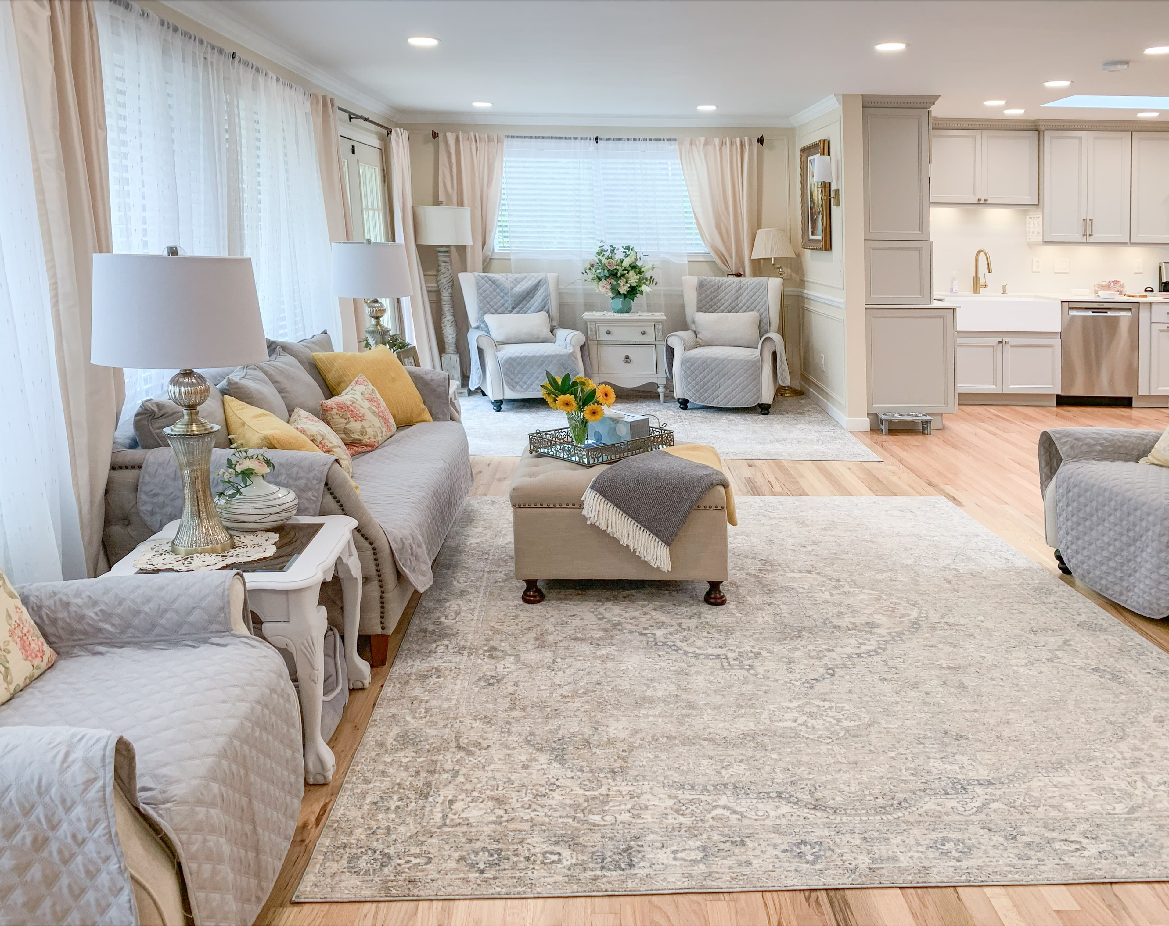 Living room view at Brookwood House with neutral upholstered seating.