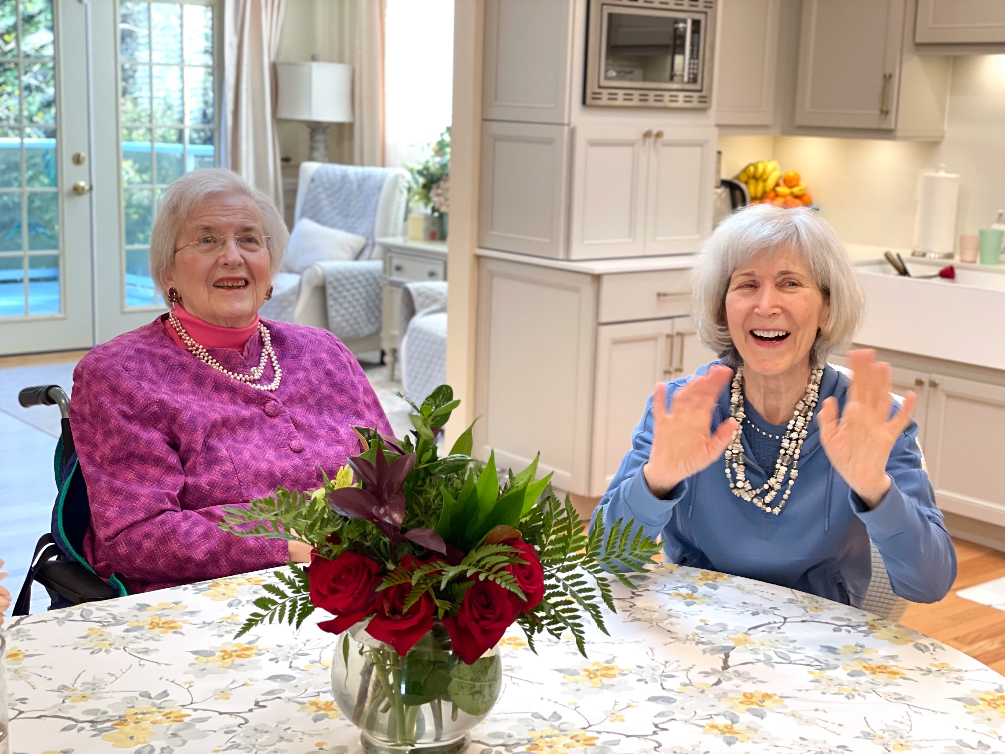 Residents and caregivers sharing time at Brookwood House.